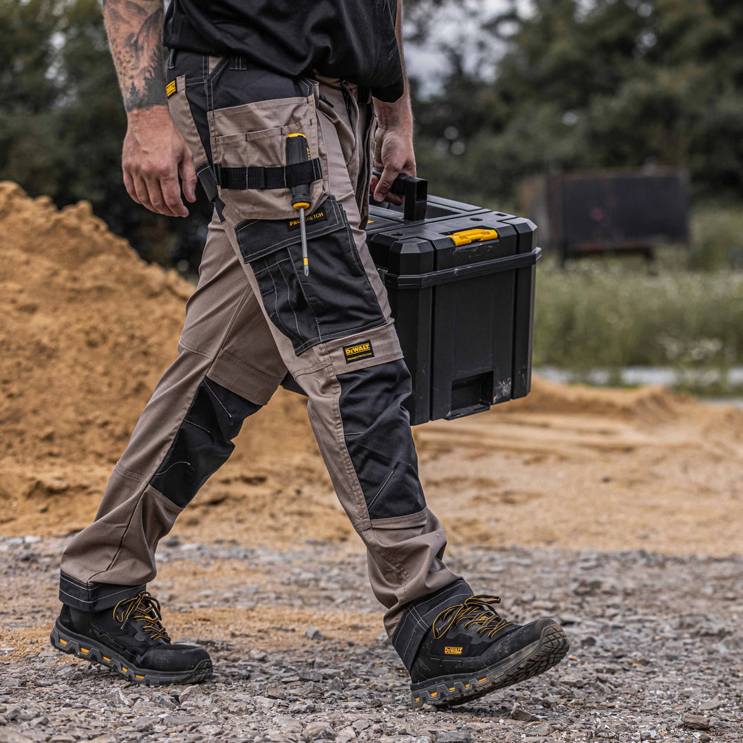 DEWALT Barstow Men's Pro-Stretch, Holster Pocket, Slim Fit Work Pants, Stone, Right Side Model View