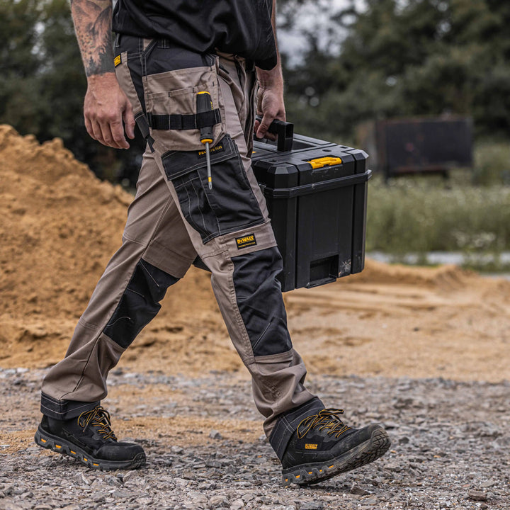DEWALT Barstow Men's Pro-Stretch, Holster Pocket, Slim Fit Work Pants, Stone, Right Side Model View