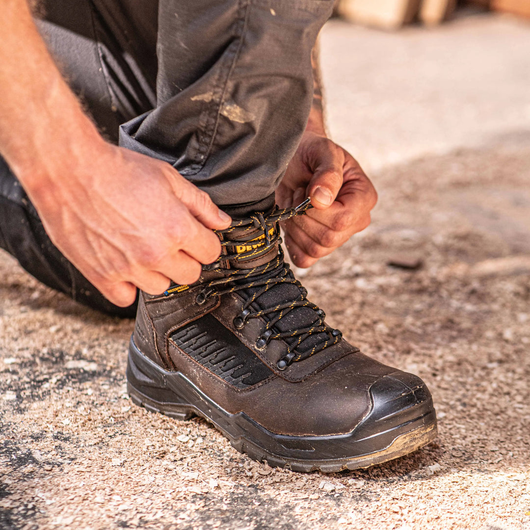 DEWALT Reynolds Men's Leather, Steel Safety Toe, Waterproof Work Boot - 3/4 Front Right Side Model Tying Laces View