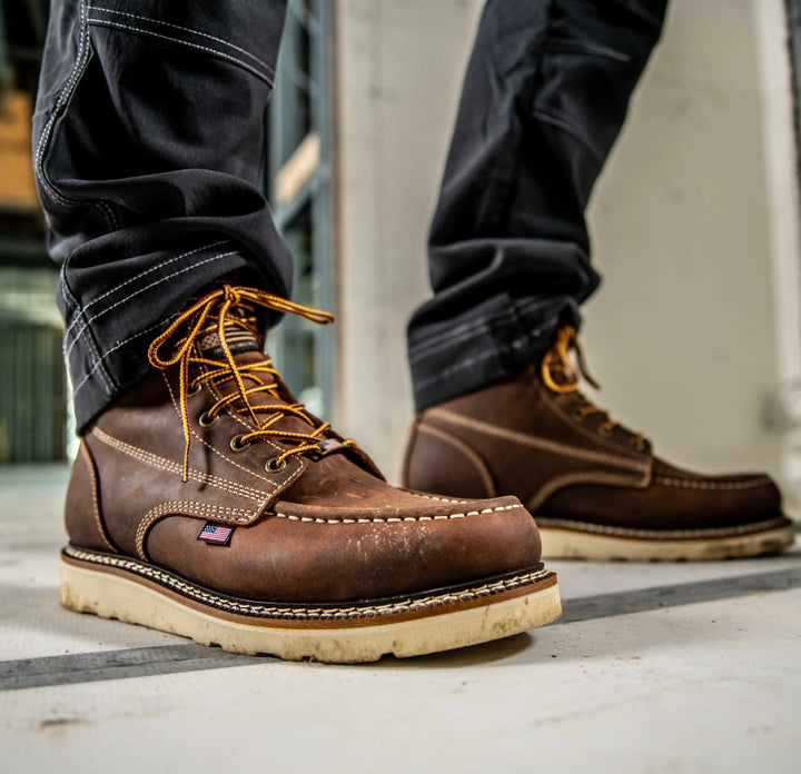 DEWALT Weatherby Men's Made in USA Pro Comfort, Full Grain Leather, Moc Toe Work Boot - 3/4 Front Right View With Model Standing